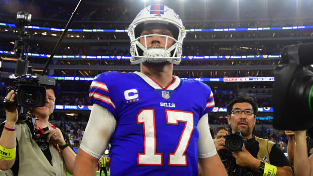 Bills quarterback Josh Allen (17) walks off the field after a win against the Rams.